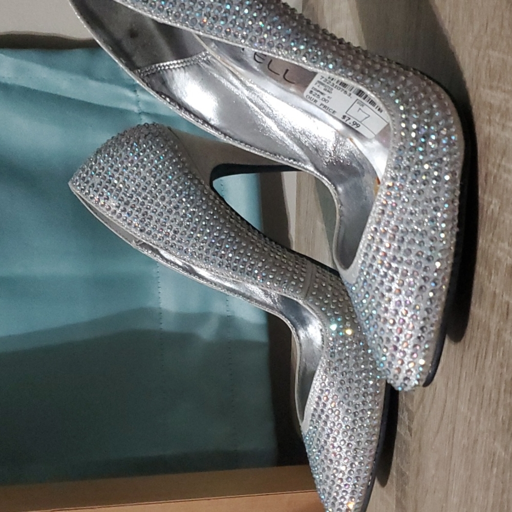 Eye catching, sliver heels covered in rhinestones.